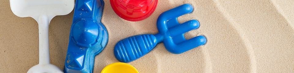 plastic toys in a sandbox